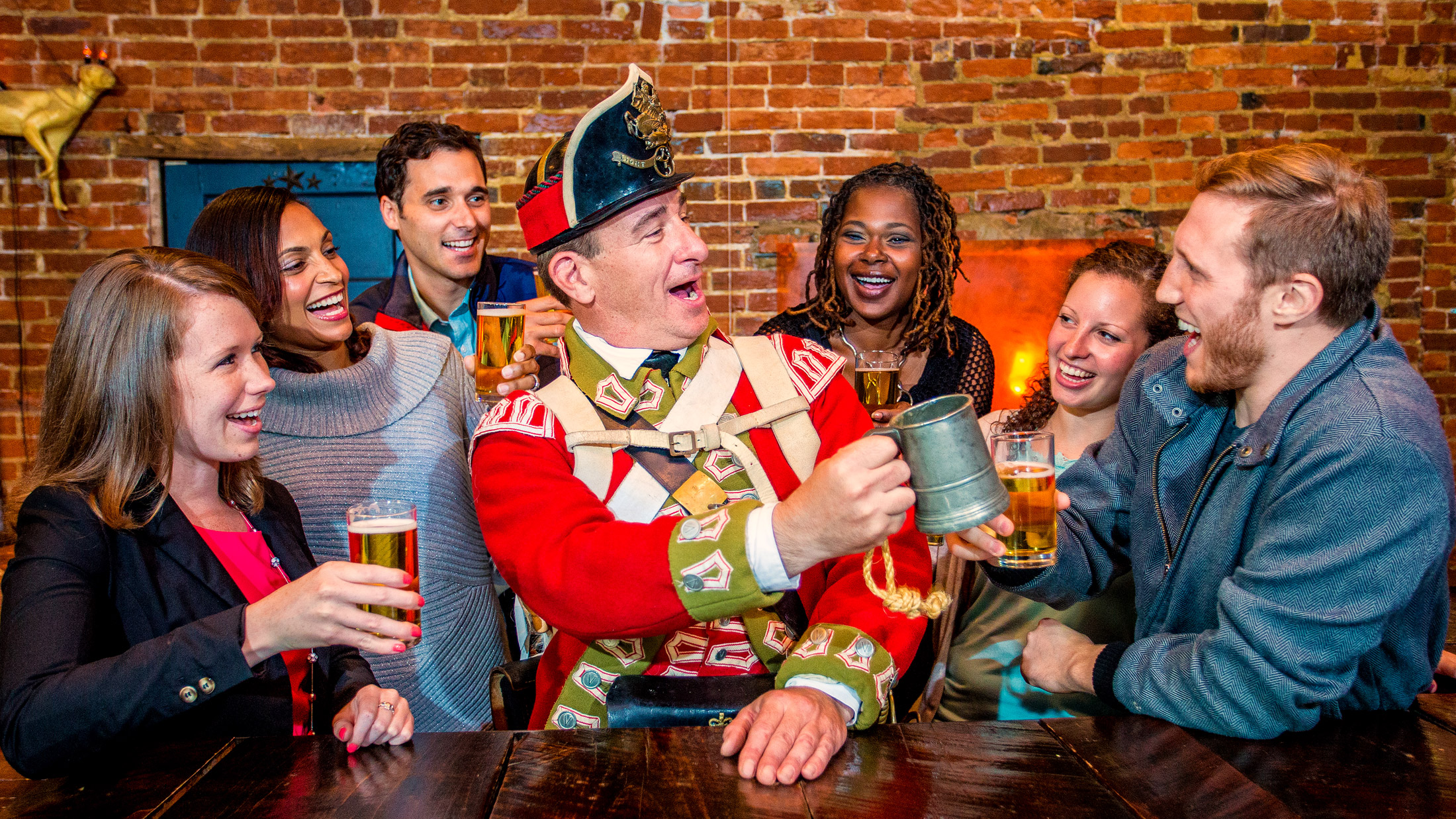 A colonial figure giving a toast during Tippler's Tour in Philadelphia's Historic District.