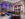 The sleek and stylish lobby bar at the Aloft Philadelphia Downtown, with large windows and colorful furniture