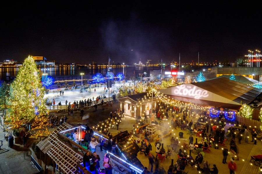 Socially distanced tables surround the ice rink at Blue Cross RiverRink Winterfest in Philadelphia