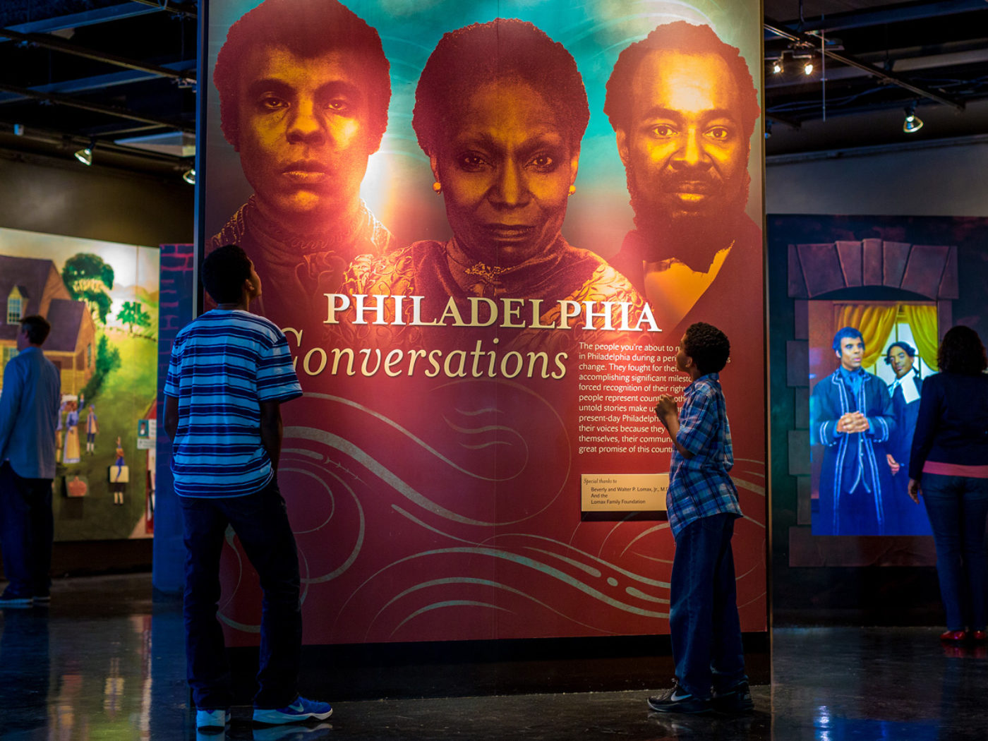 Two children read a panel at The African American Museum in Philadelphia