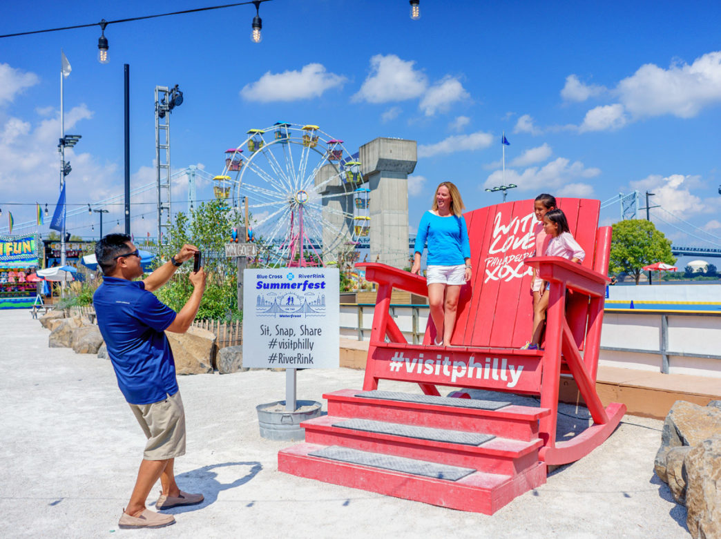 People taking pictures at Blue Cross RiverRink Summerfest
