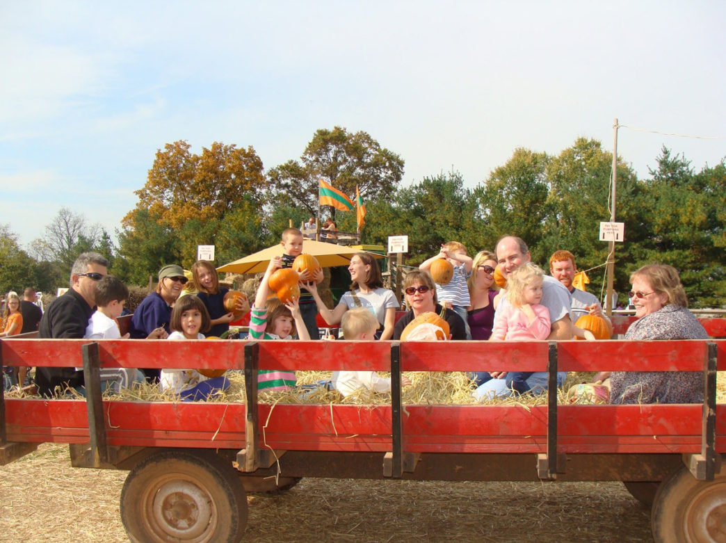 Visitors on a wagon ride at Freddy Hill Farms' Fallfest