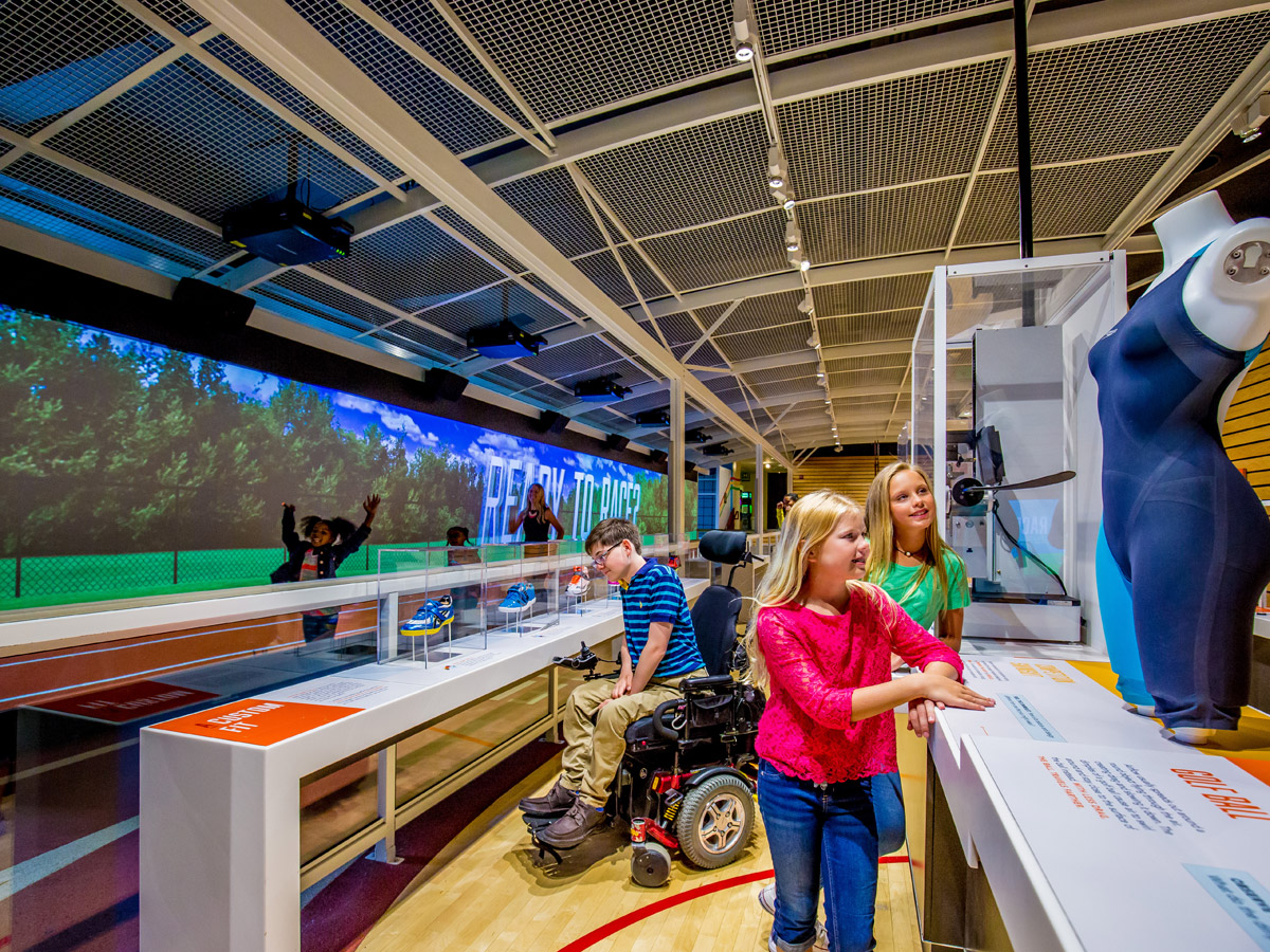 Visitors of all ages and abilities, including those in wheelchairs, explore the exhibits at The Franklin Institute.