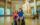 A young visitor using a wheelchair poses for a selfie in accessible The Franklin Institute lobby