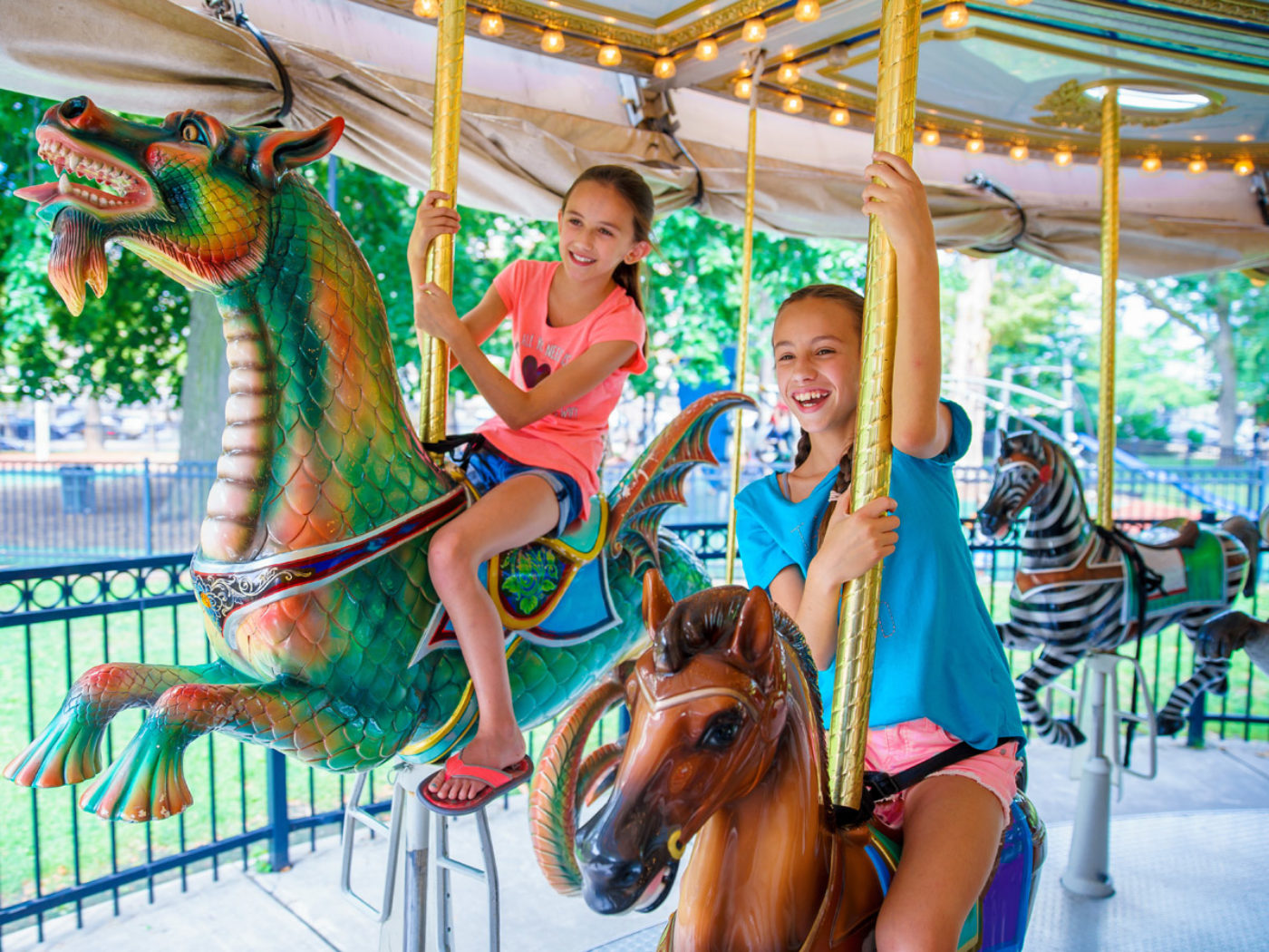 Children riding the carousel at Franklin Square