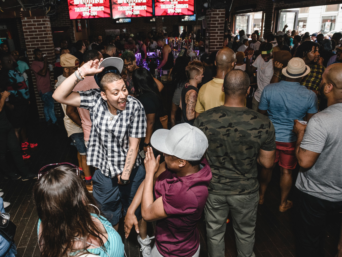 People dance at a bar as part of Philly Black Pride festivities.