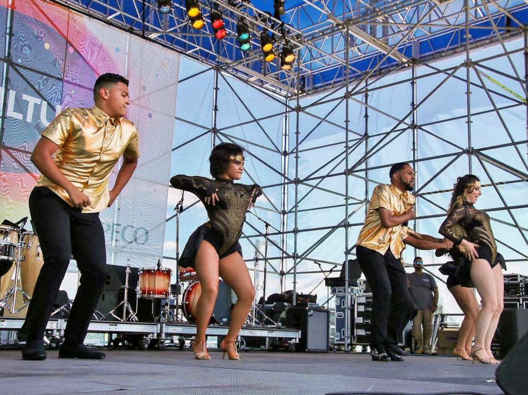 Performers dancing on stage at the Hispanic Fiesta at the Great Plaza at Penn's Landing