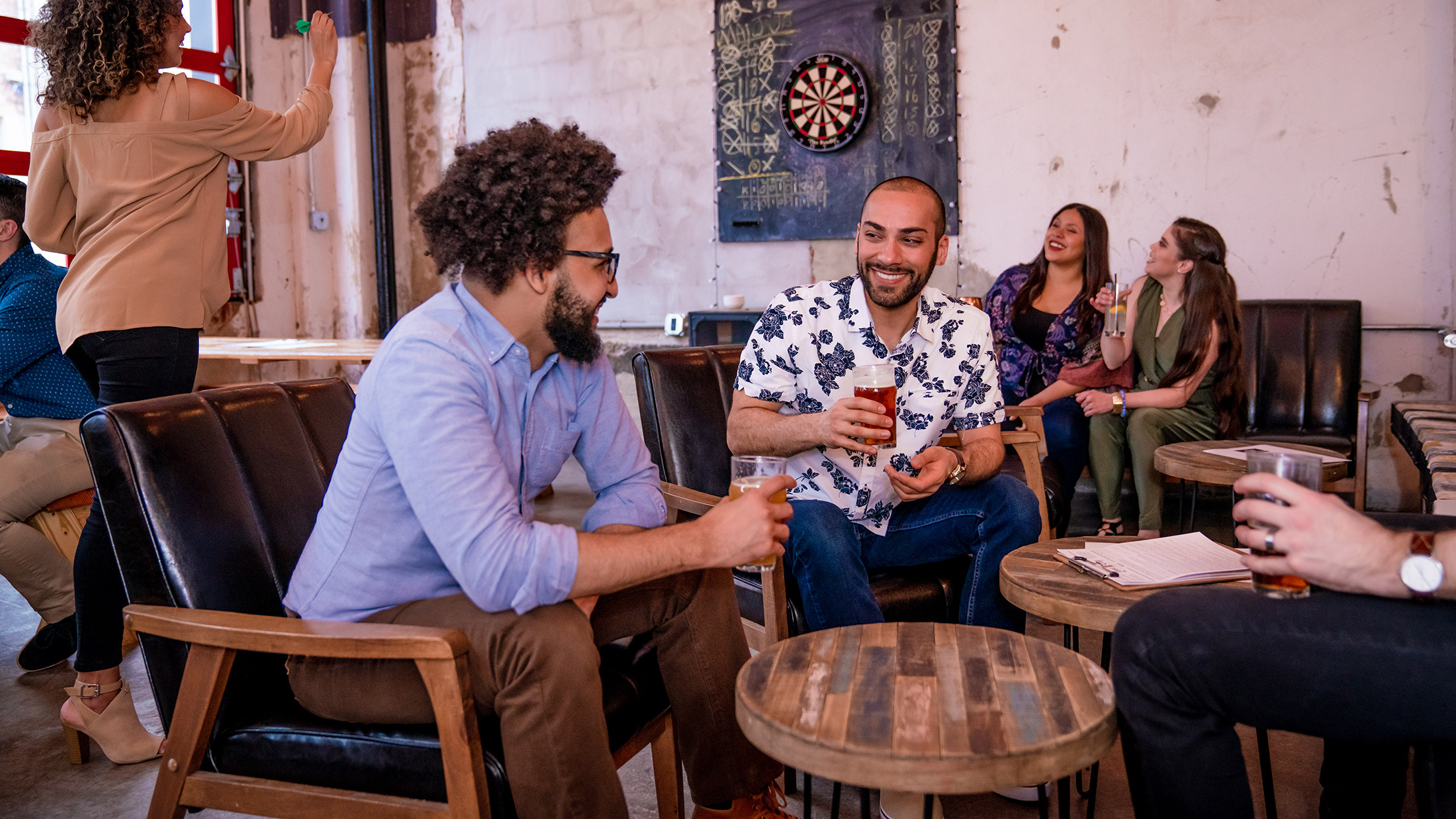 Friends drinking beer at Love City Brewing Company in Philadelphia