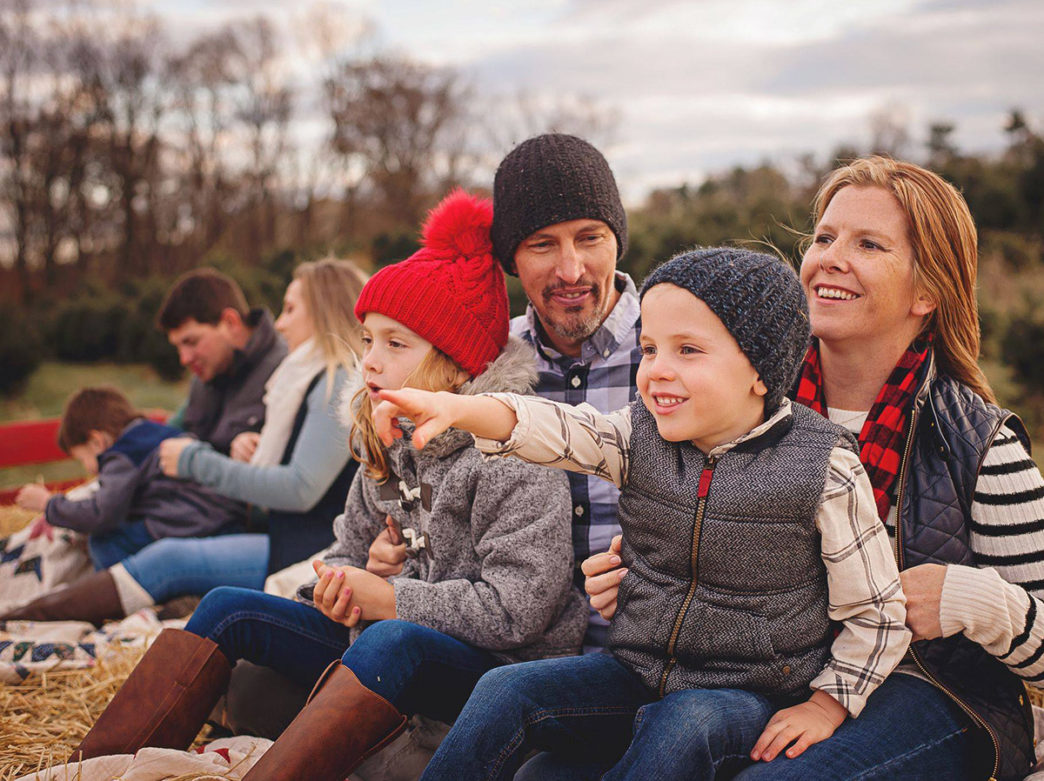 Family on a winter hayride through Linvilla Orchards