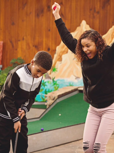Family playing mini golf at Linvilla Orchards