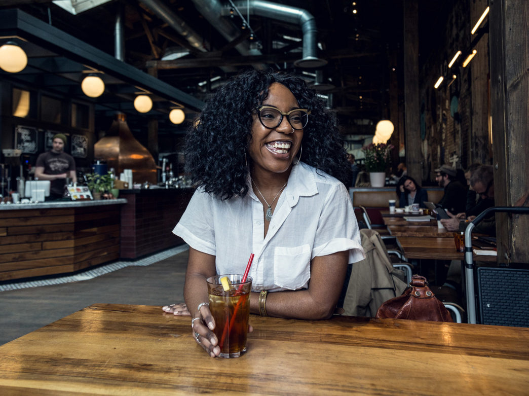 Woman drinking coffee at La Colombe in Philadelphia