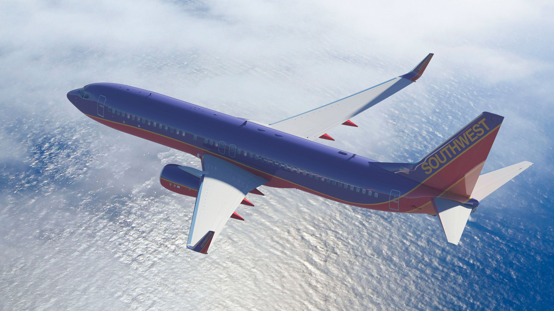 Southwest Airlines airplane flying over water