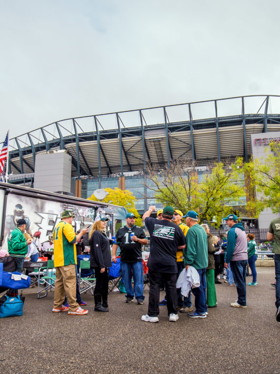 Eagles fans tailgating in the parking lot in front of Lincoln Financial Field.