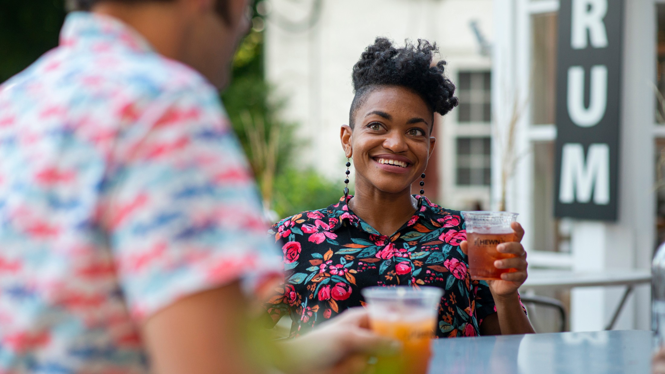 A woman has a drink at Peddler's Village in New Hope