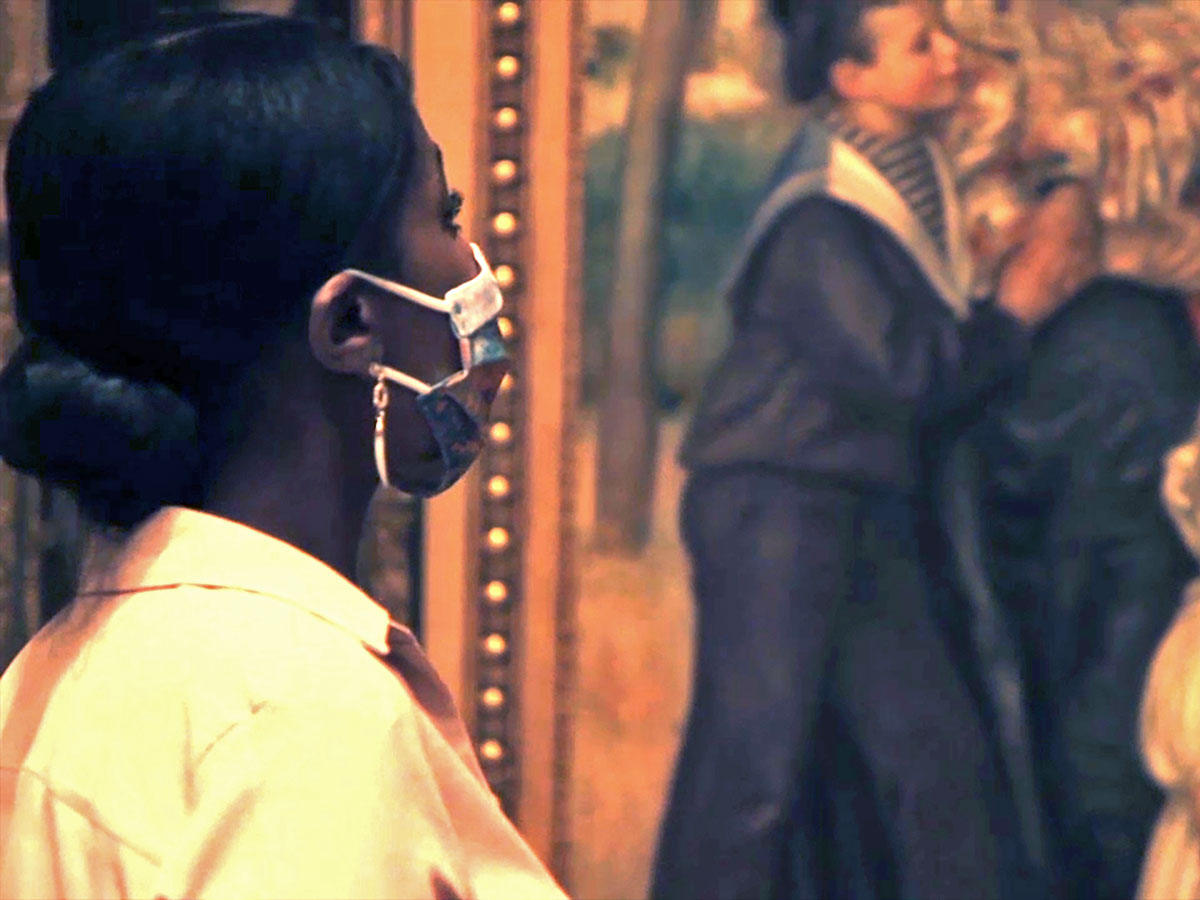 A masked woman views artwork at the Barnes Foundation in Philadelphia.