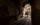 Two people explore Eastern State Penitentiary at night in Philadelphia