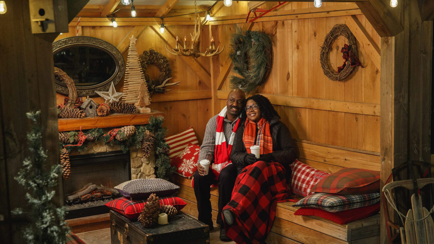 A couple sits insideof a private cabin at the Blue Cross RiverRink Winterfest in Philadelphia