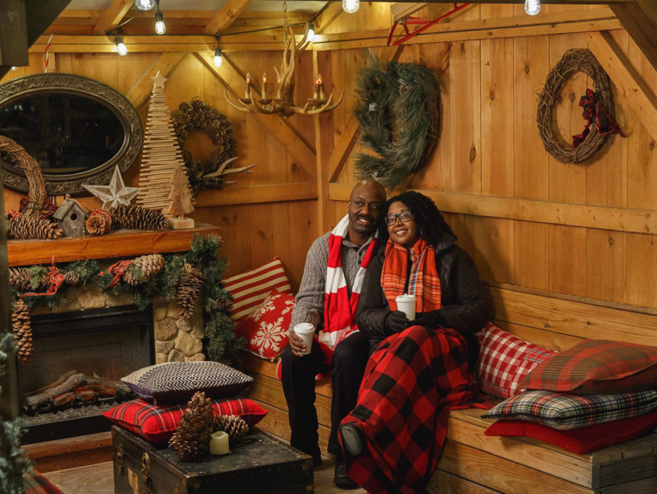 A couple sits insideof a private cabin at the Blue Cross RiverRink Winterfest in Philadelphia
