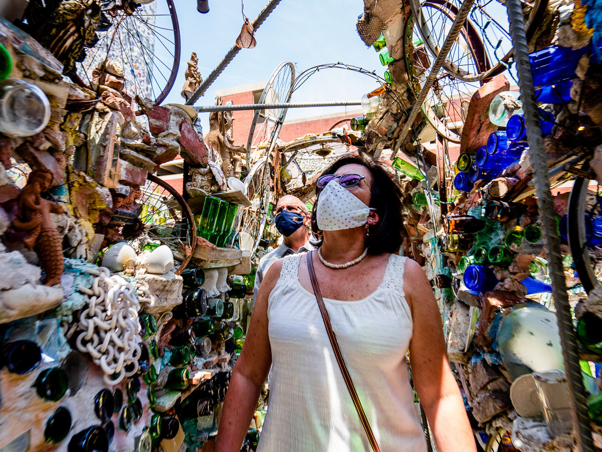 Visitors to Philadelphia's Magic Gardens wear Covid 19 masks