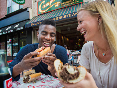 Man and woman eating at Campo's Cheesesteaks