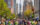 People run down Broad Street with City Hall in the background during the Broad Street Run in Philadelphia.