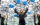 A woman throws balloons into the air inside a mirrored room at the Museum of Illusions