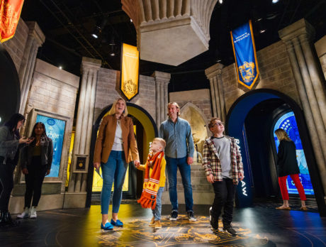 A family enters Harry Potter: The Exhibition at The Franklin Institute