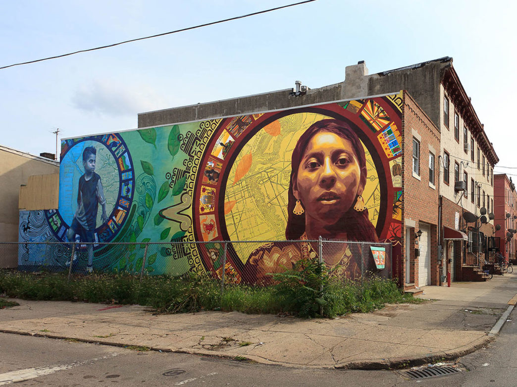 The Aquí y Allá mural depicts Mexican immigrants