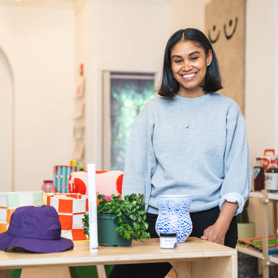 Shannon Maldonado poses in front of some items in her shop, YOWIE