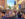A crowd of people walks a street in Philadelphia during the Old City Eats Block Party