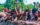 A crowd of people smiling at The Roots Picnic