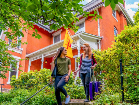 A couple walks down the stairs outside Akwaaba Bed & Breakfast in Philadelphia