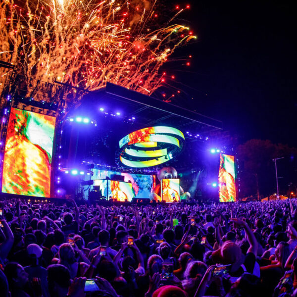 Fireworks explode above the stage at nighttime during the Made in America festival
