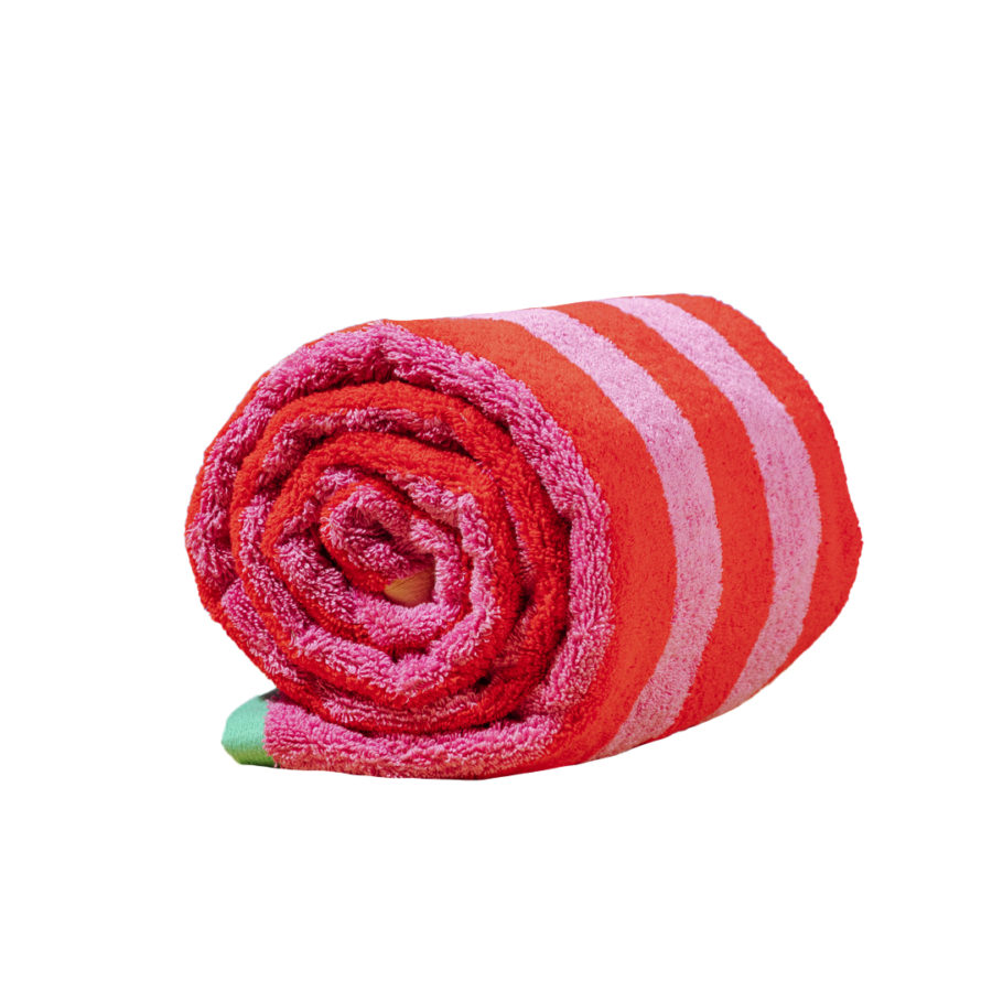 A towel with red and pink stripes from YOWIE rolled up