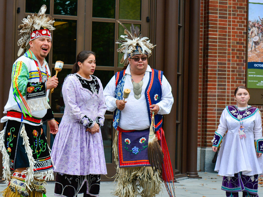 Indigenous dancers perform outside of the Museum of the American Revolution