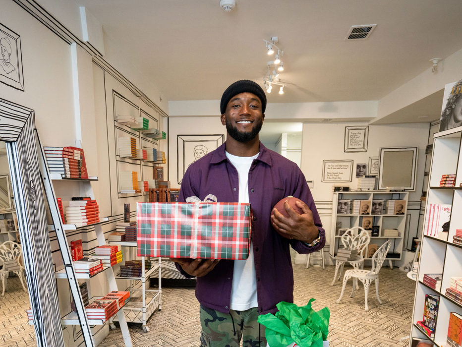 Philadelphia Eagles Cornerback James Bradberry, holding gifts