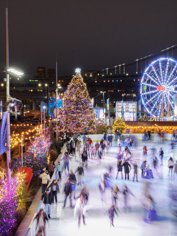 People skating on the ice rink at Blue Cross RiverRink Winterfest