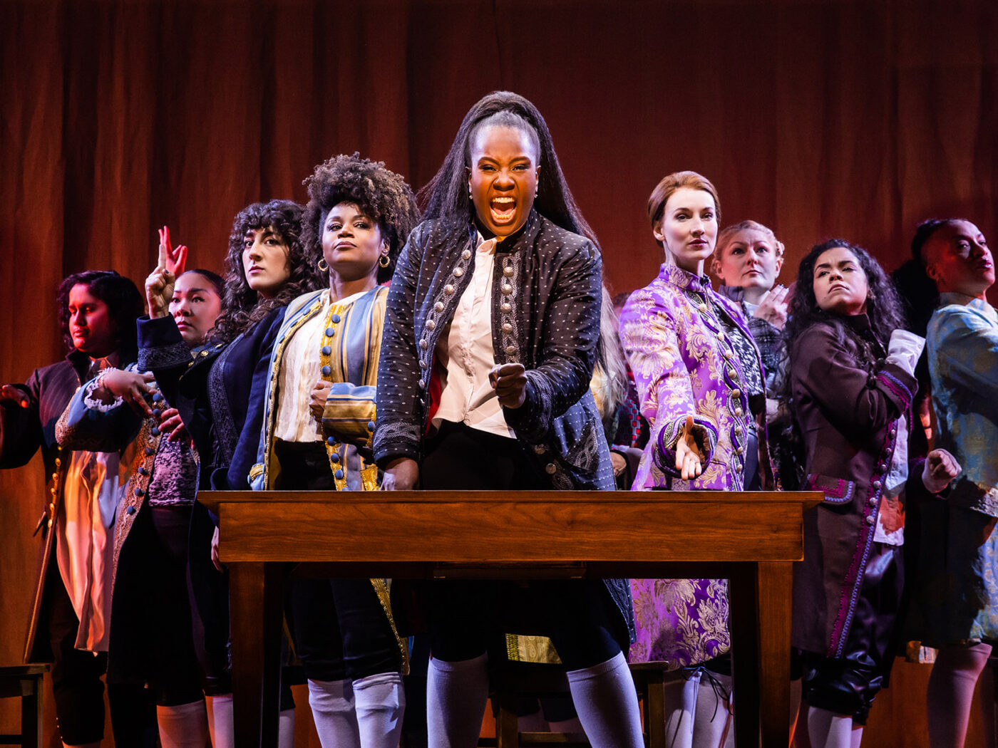 The cast of the Broadway show 1776 performs, singing into the camera