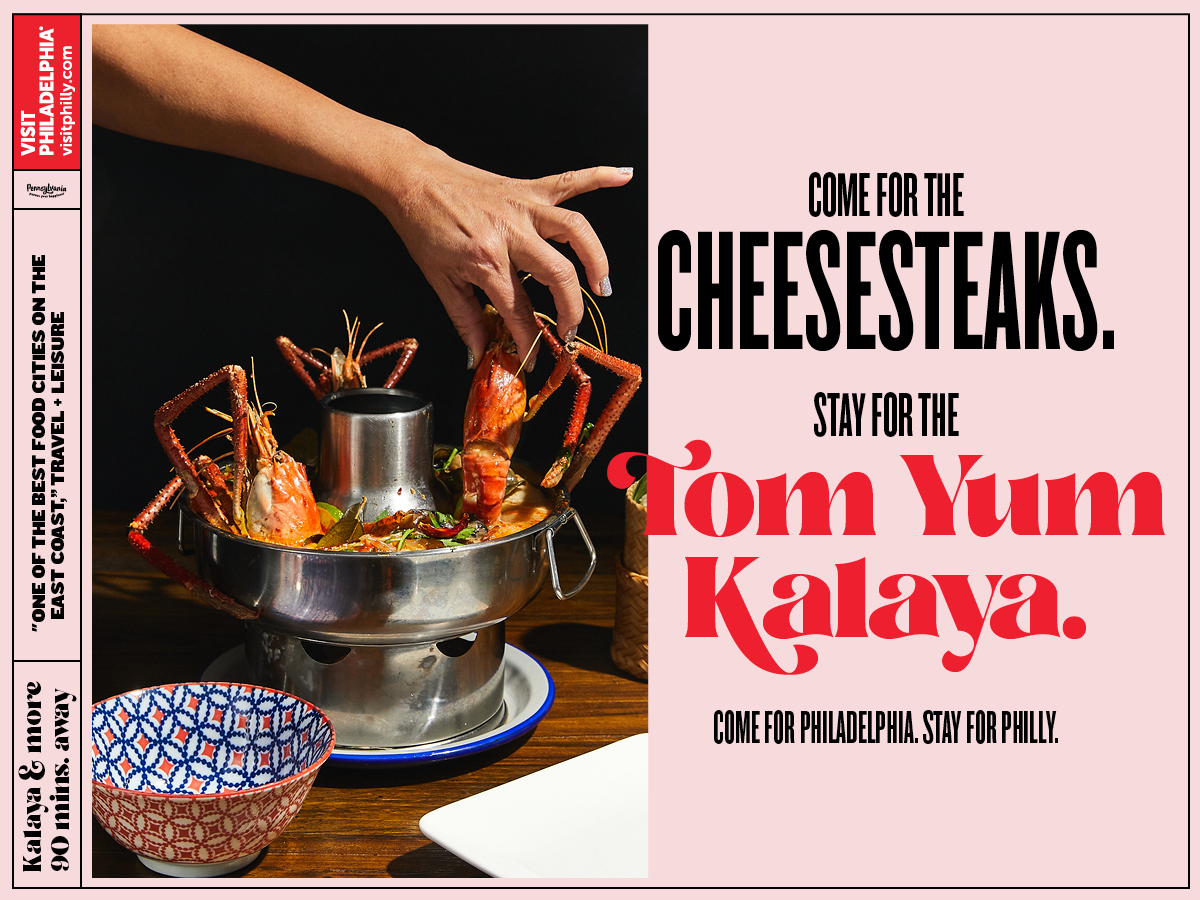 An image featuring a hand reaching for food in a dish that says Come for the Cheesesteaks, Stay for the Tom Yum Kalaya