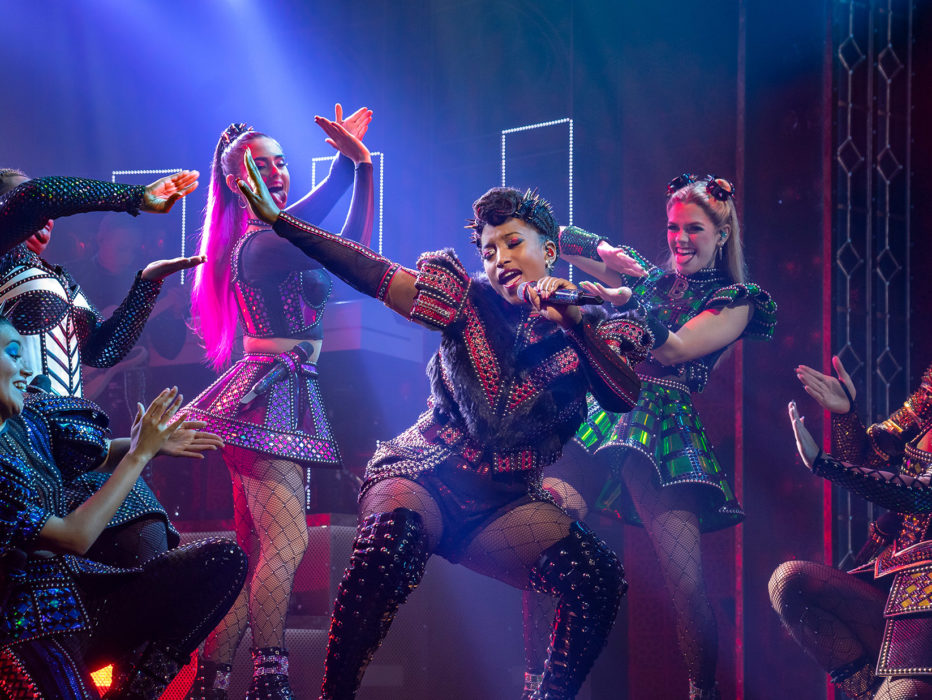 Performers with SIX singing and dancing