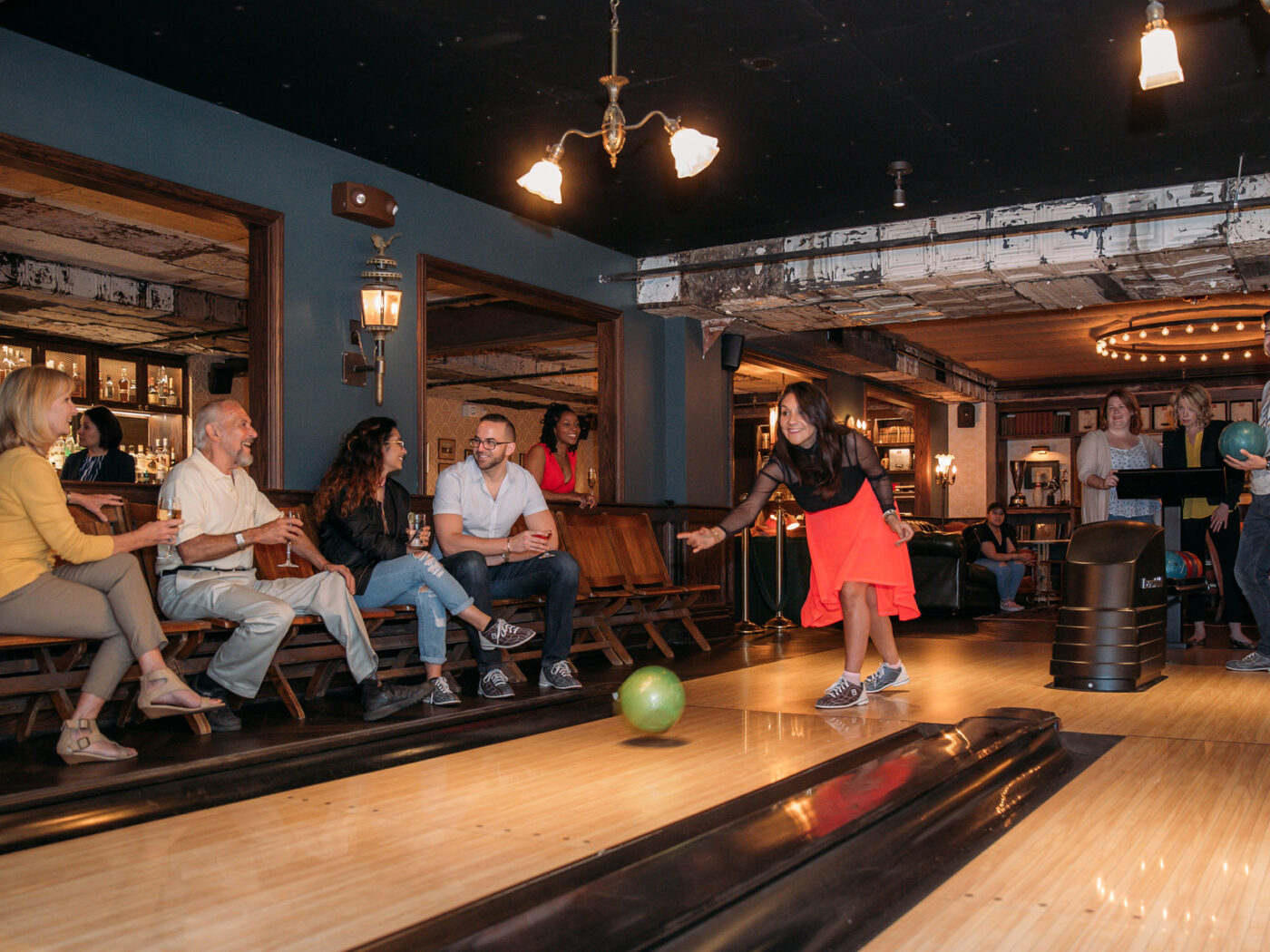 People bowling at Elbow Lane at Harp & Crown
