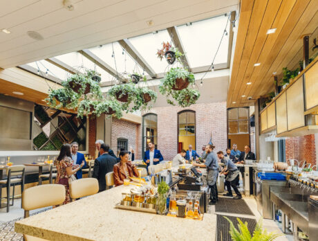 People at the Hook & Ladder Sky Bar connecting to the main hotel