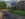 People bike and walk past a house on Boathouse Row in Philadelphia on the Schuylkill River Trail