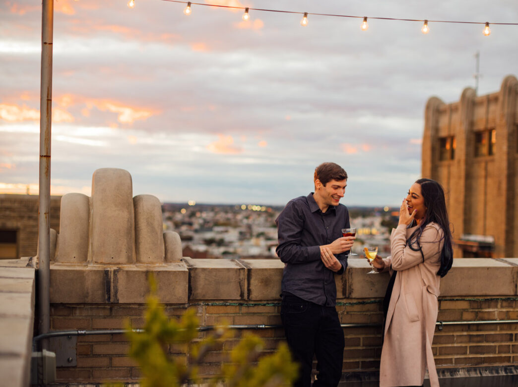 Man and woman outside on the roof of Irwin's