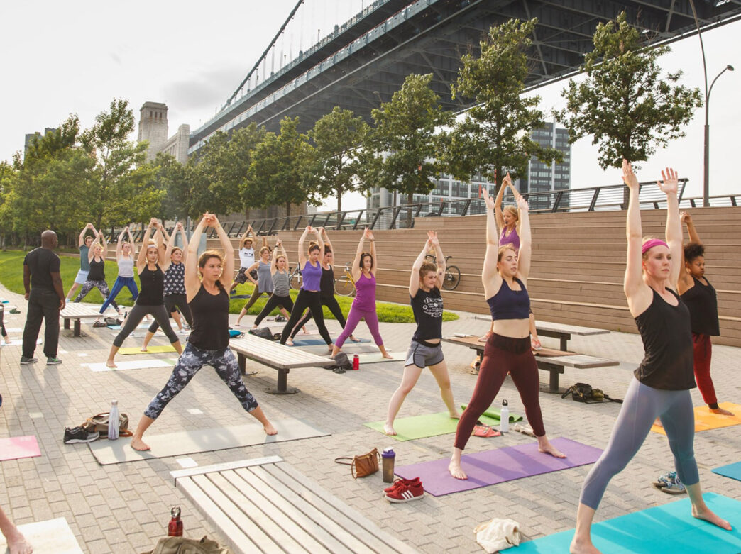 People doing yoga at Race Street Pier