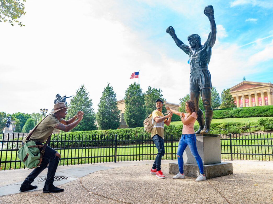 People posing in front of the Rocky Statue