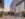 People walk through the courtyard between gleaming buildings at the Piazza in Philadelphia