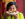 Chutatip “Nok” Suntaranon from Kalaya Thai Kitchen holds up a plate of food in front of her face.