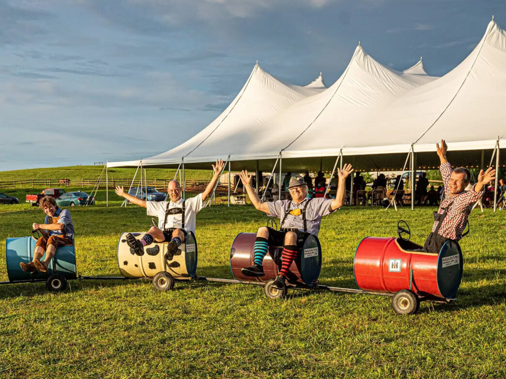 Men in little cars during Oktoberfest
