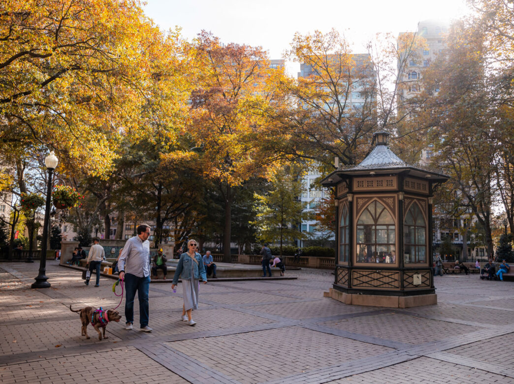 People walking through Rittenhouse Square Park